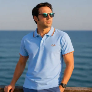 Polo celeste con banderas cruzadas de España hombre